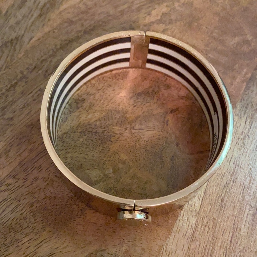 Henri Bendel thick, gold bracelet.